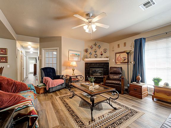 Living room with fireplace. Glass door is the entry to the office/study/3rd bedroom