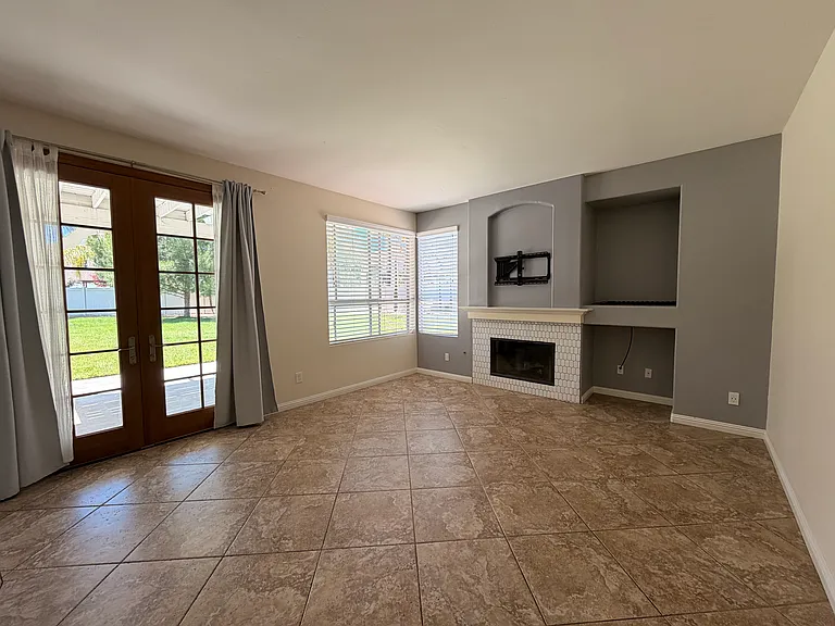 Back living room with french doors to backyard.