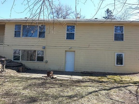 Back of the house, patio and walk-out.