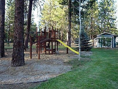Nice play area in spacious back yard.
