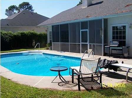 Inground pool in fenced back yard