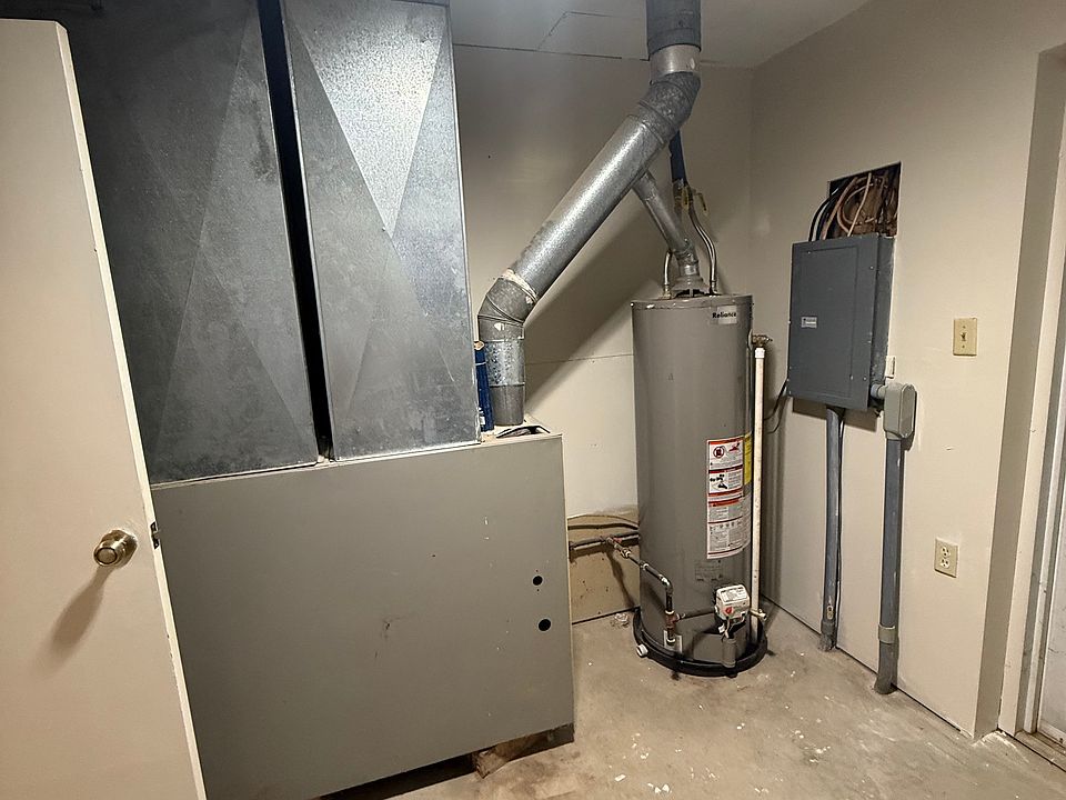 Storage Room Water Heater, Electric Panel and Furnace