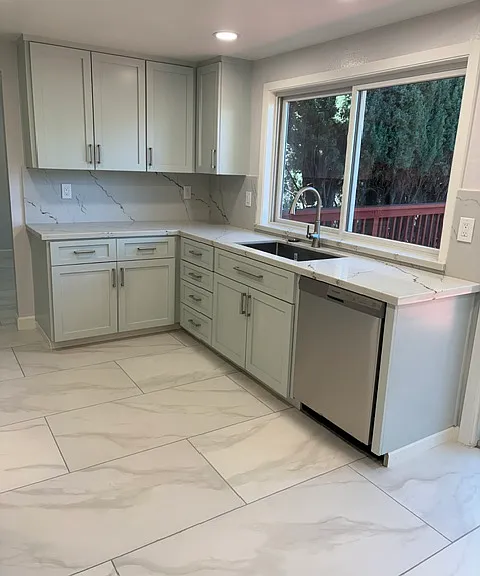 New kitchen sink and dishwasher with window facing backyard