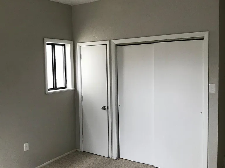 Bedroom. View of closet doors.