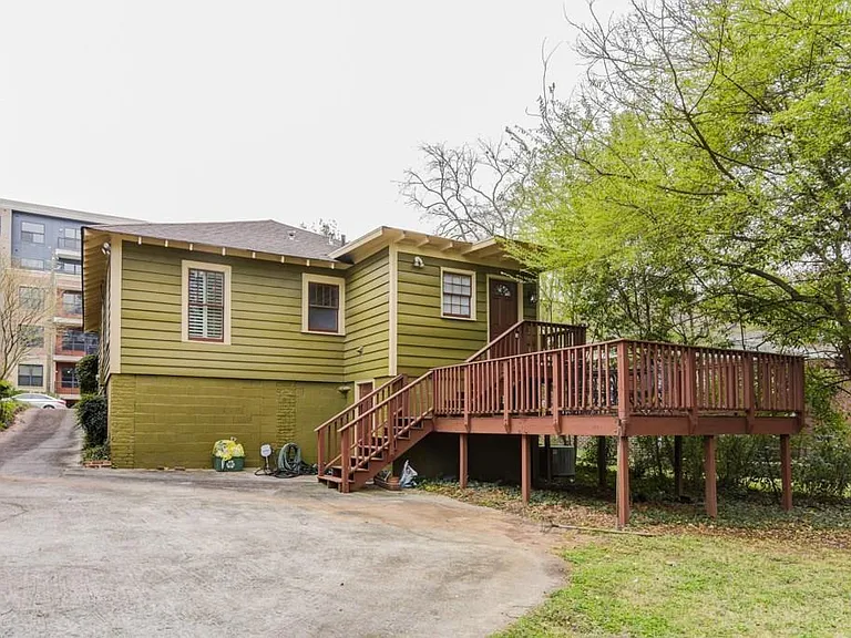Rear of home with parking