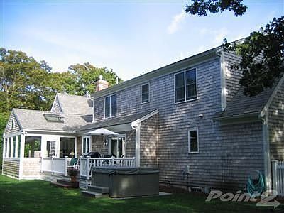 Back of house with view of porch/deck.