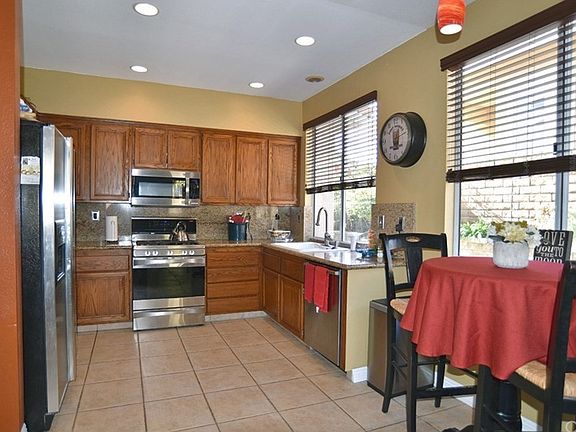 KITCHEN: Eat-in kitchen, granite counters, stainl