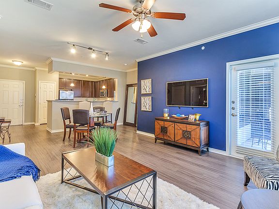 Large Living Room with open concept kitchen and ceiling fan