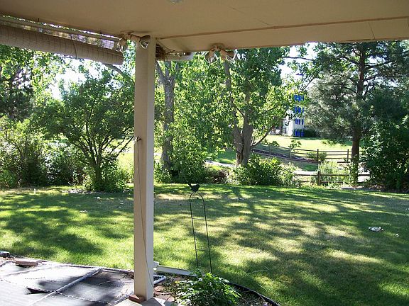 View of back yard and greenbelt from patio