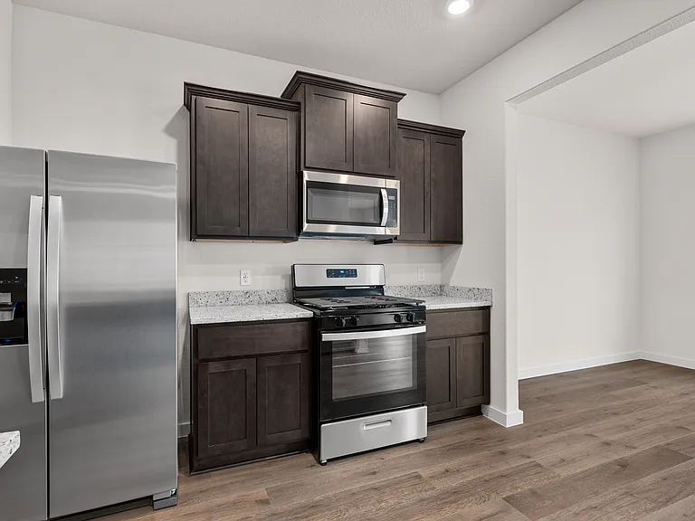 The kitchen has sprawling granite countertops.