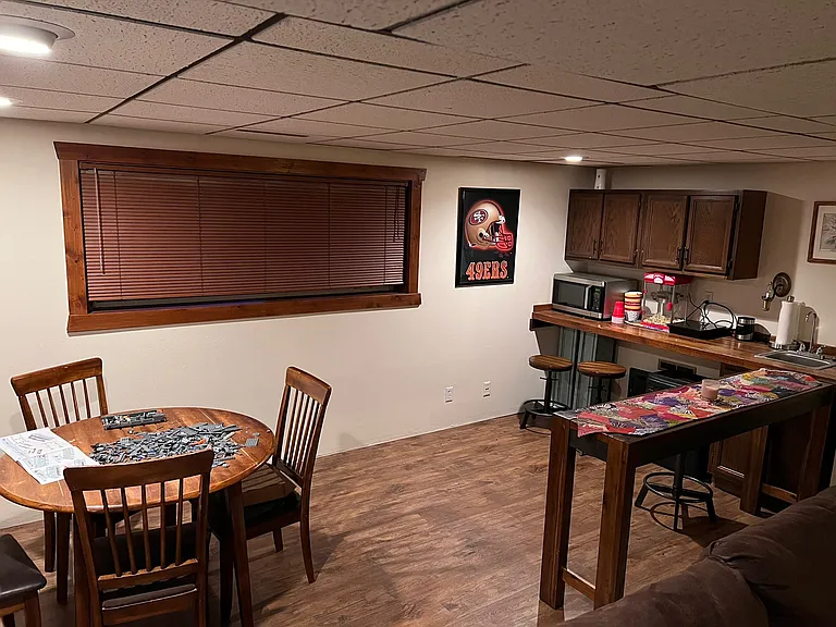 Open bar/kitchen area in basement floor.