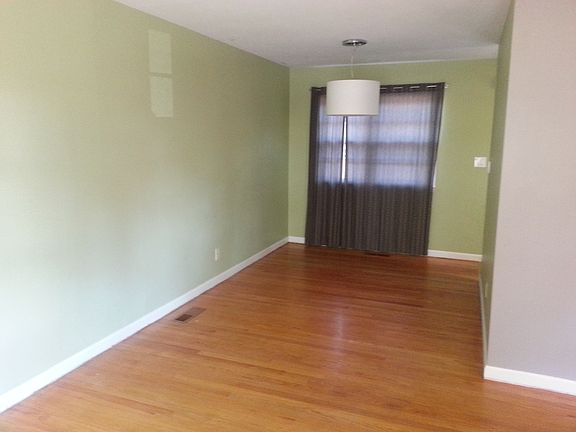 Dining room with contemporary light fixture