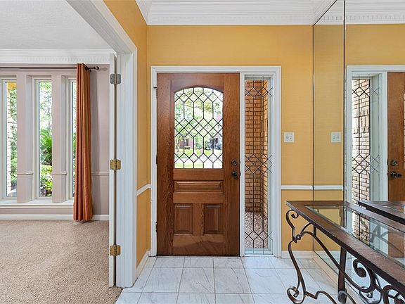 Impressive entry with beautiful wood and lead glass door.