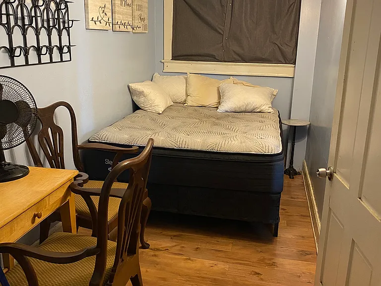 Bedroom with queen size bed, desk and closet (behind)