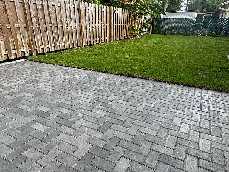Beautiful brand new patio at your backdoor overlooking small tropical yard.