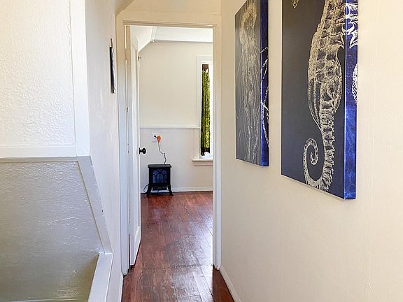 This hallway upstairs leads to both upstairs bedrooms, the Troy room visible here.