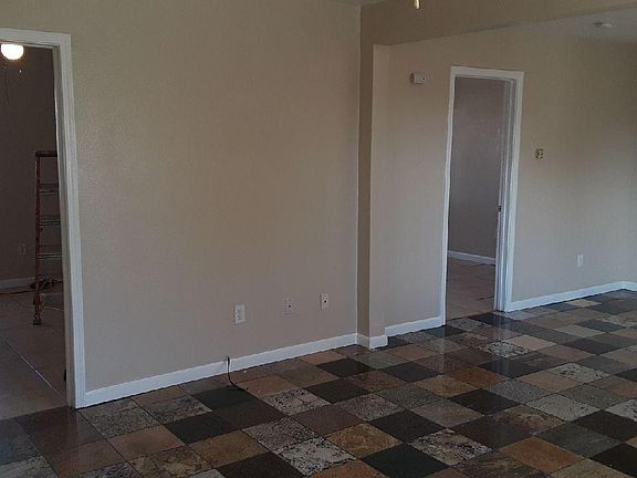 Living area and entry way to room 1 and 2.