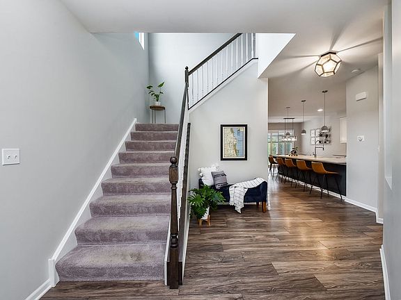 Enter the front door to vaulted ceilings, upgraded light fixtures, and an open floor plan.