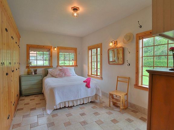 Master bedroom with wall of pine closets and lots of room for furniture