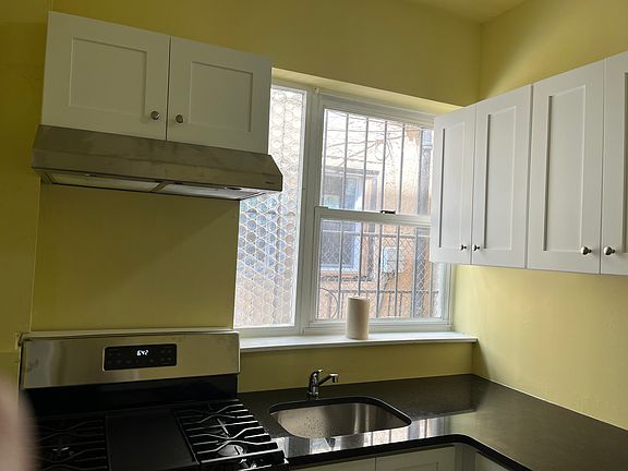 New kitchen: new cabinets, granite countertops, gas range, hood and flooring.