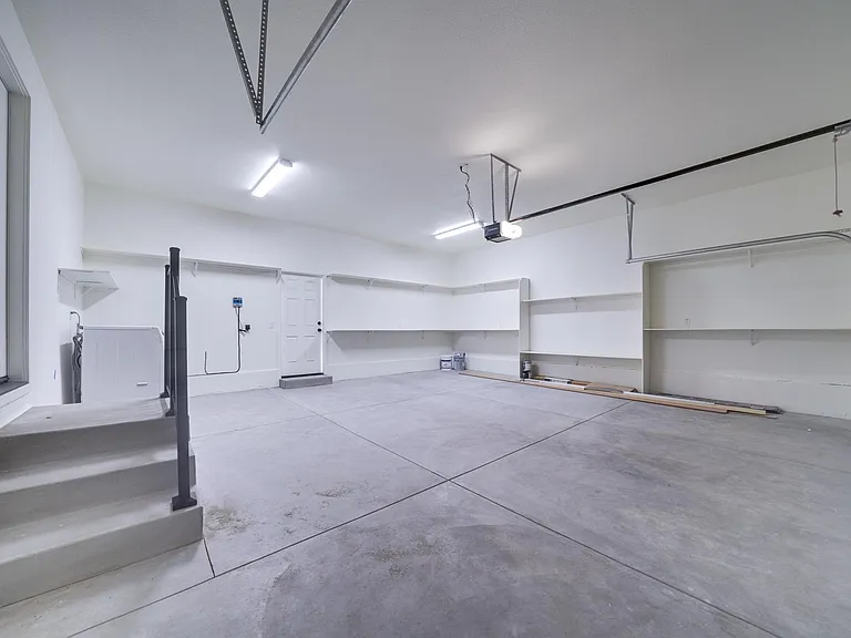 Brand new 2 car garage. New paint, ample shelves/storage, wifi garage door opener (manual openers also available). Garage steps include safety railing.