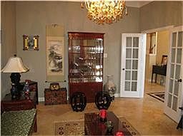 Handsome Study with 2'blinds and travertine flooring.