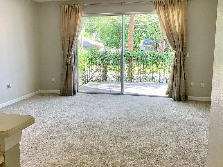 Living room overlooking private back 
deck