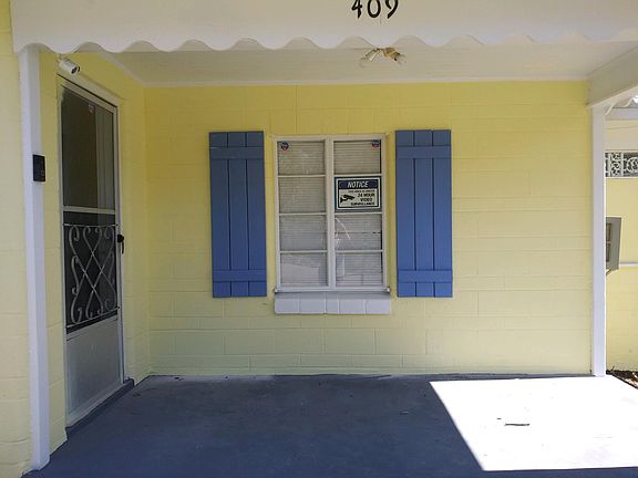 Painted porch and new window shutters. Notice Ring doorbell.