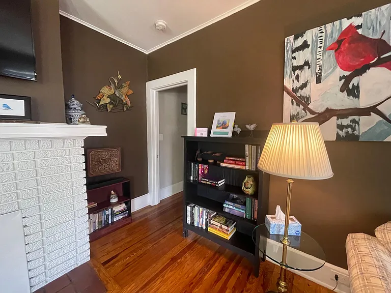 The home is decorated with birds. There are cards and some reading material.