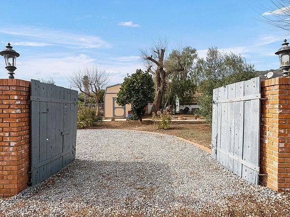 Circle drive entrance (for guest parking). Tenant parking spot located next to casita.