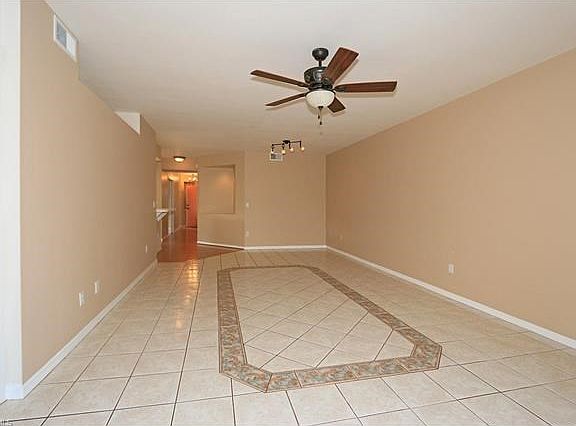 Great Room - Living/Dining view from lanai in. Lovely Tile Inlay, niche for decorating.