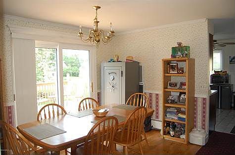 Dining room with sliders to deck