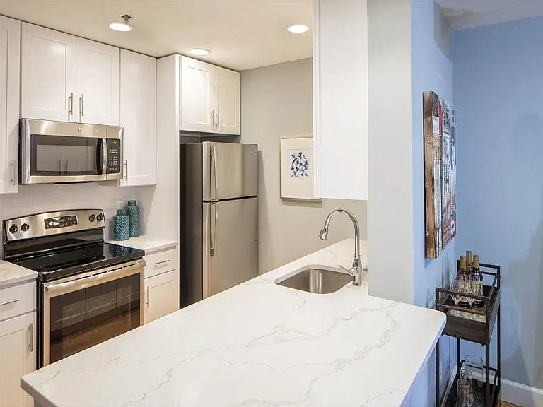Gourmet Kitchen with Dishwasher, Garbage Disposal, Microwave, Granite Countertops, and Modern Appliances