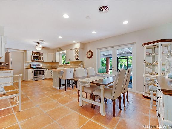 Open kitchen and dining along with breakfast bar