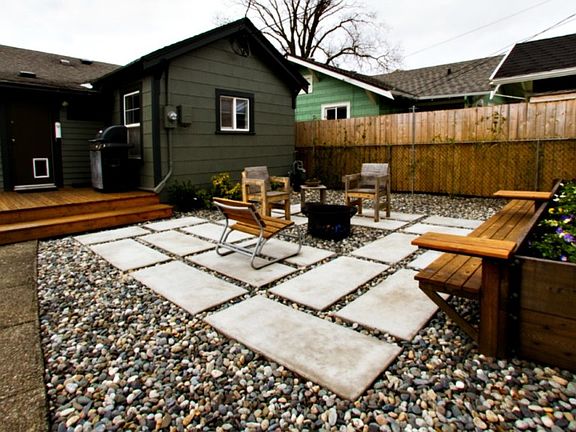 The custom patio with firepit in the back yard is private and perfect for hanging out with friends and family.
