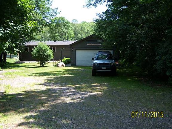 Driveway in with 2 car garag