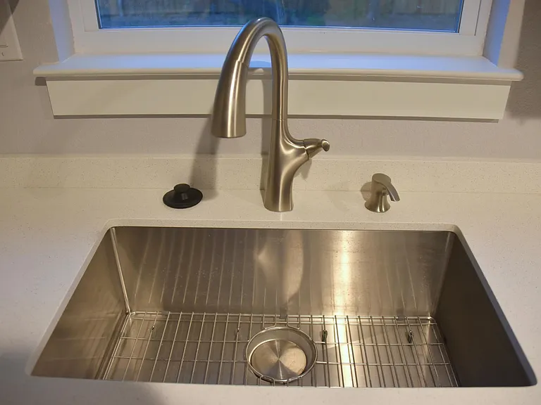 Kitchen faucet with soap dispenser, deep stainless sink