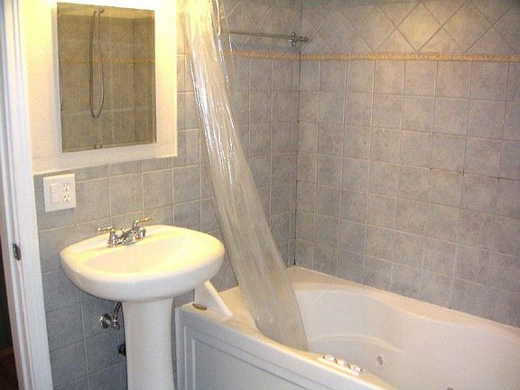 Master Bath, 1 of 2 sinks and jacuzzi tub/shower