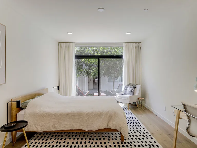 Private-entry guest suite featuring a kitchenette, walk-in closet, and full bathroom. A flexible space perfect for guests, multigenerational living, a home office, or creative studio.