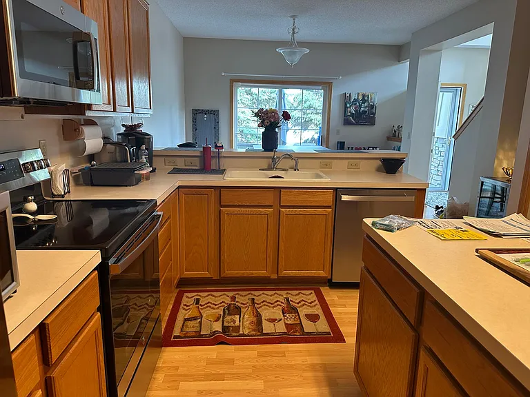 Kitchen with counter and appliances