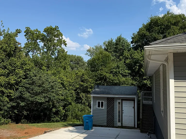 Driveway View with storage building.