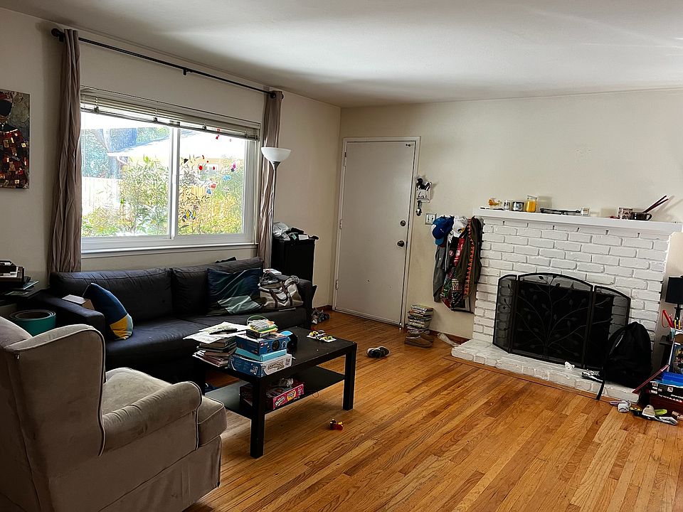 Living room with wood burning fireplace