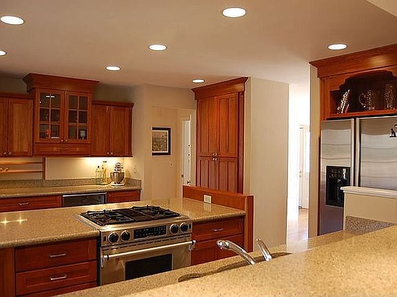 Stainless appliances, custom lighting, granite counters