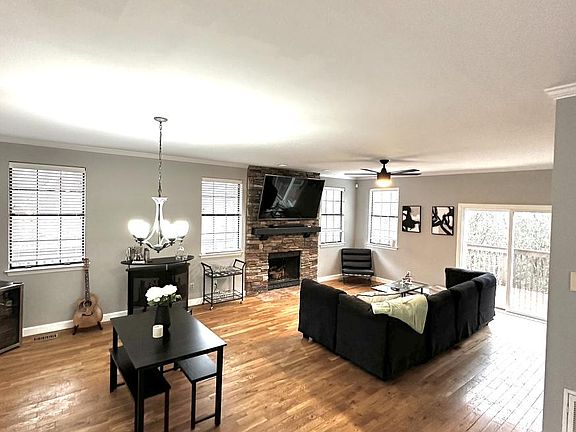 Spacious Living Area/Main floor lounge room, w/ Fireplace, dining area, bar and large TV.