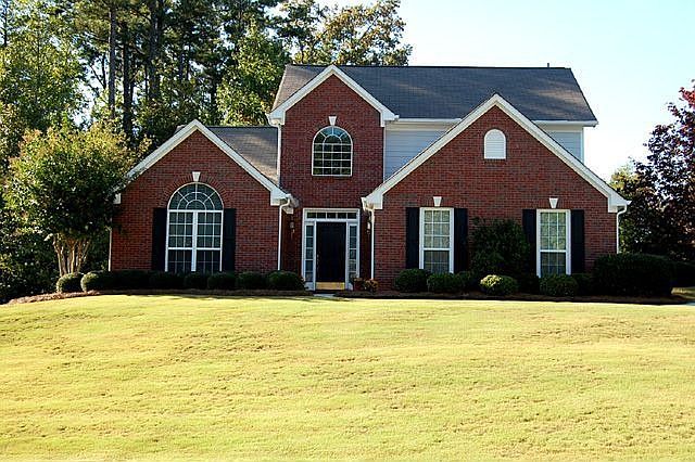 Brick Front Home on a Corner Lot with Large Lawn