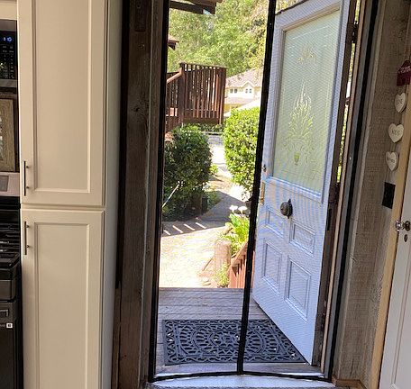 front door leads into the kitchen