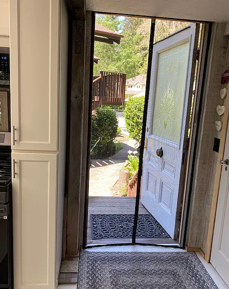 front door leads into the kitchen