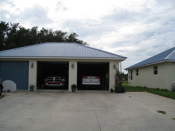 Garage has huge workshop, 1/2 bath and attic storage