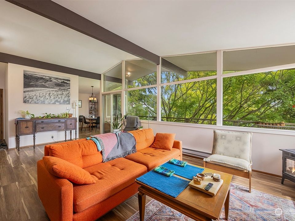 Spacious vaulted-ceiling living room with a spectacular view of Mt. Rainier and Japanes maple.