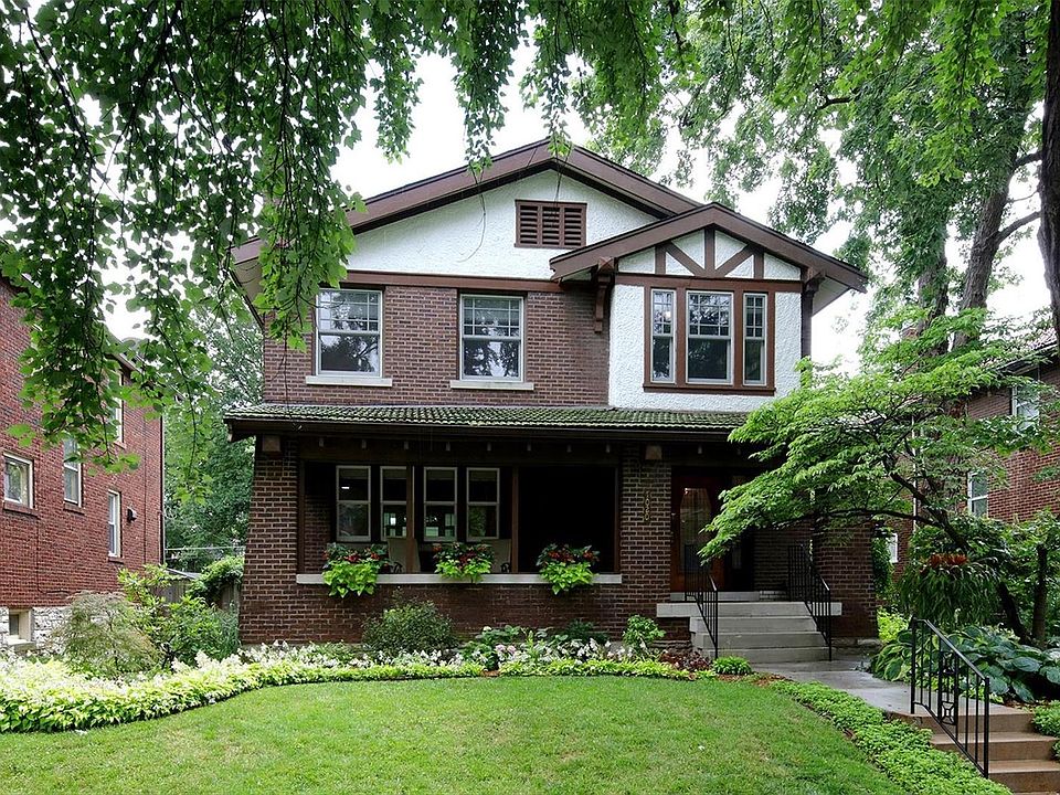 Gracious front entry - meticulous landscaping and a welcoming covered front porch.